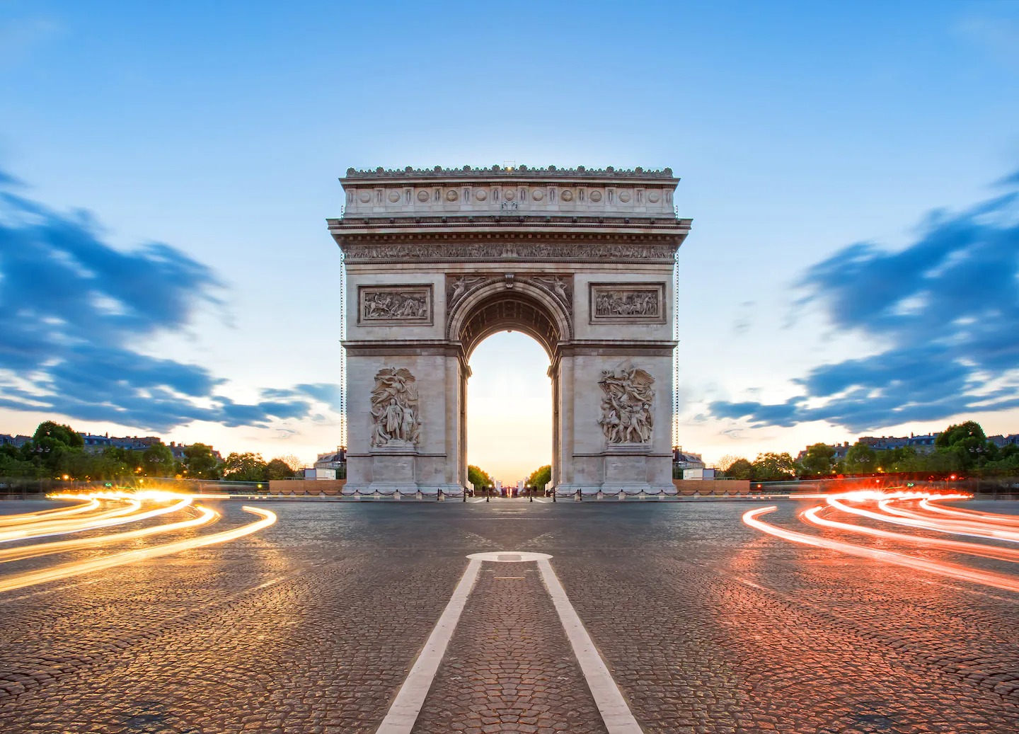 stock-photo-paris-street-at-night-with-the-arc-de-triomphe-in-paris-france-315886463